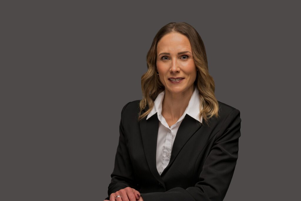 Kristen Bauman, female therapist and counsellor at Oakville Wellness Center, smiling in professional headshot