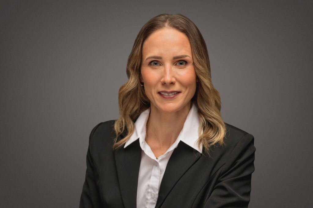 Kristen Bauman, female therapist and counsellor at Oakville Wellness Center, smiling in professional headshot